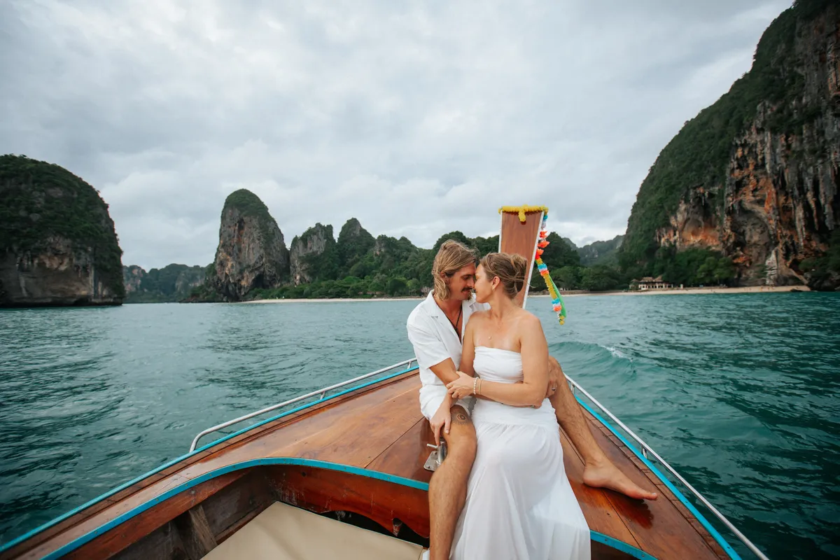 Private Vows at Railay of Eric and Corrine by long tail boat around Railay and Pra Nang beach during Thailand's beautiful summer season.The couple stayed at Rayavadee hotel,